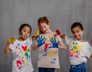 portrait-of-happy-kids-with-finger-colours-and-pai-2023-11-27-05-29-32-utc-1.jpg